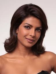 The hair is divided at the center and moved to the back for a stunning look, . Pictures Priyanka Chopra Hairstyles Priyanka Chopra Medium Layered Haircut