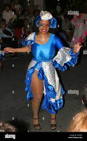 Beautiful woman with very big boobs dancing during the Desfile de llamadas  in carnival in the street of Montevideo Uruguay Stock Photo - Alamy