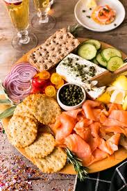 In this plate, we put a spin on bagels and shmear by putting it on naan flatbread with goat cheese. Smoked Salmon Appetizer Platter Kimbrough Daniels