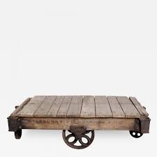 This impressive wagon wheel styled coffee table will make a delightful and functional addition to your home. Antique Lineberry Cart Coffee Table Industrial Cast Iron Wood N Carolina 1940s