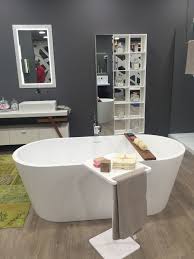 A Small Side Table For The Bathtub Decoist Amazing Bathrooms Modern Bathroom Bathroom Shelves For Towels