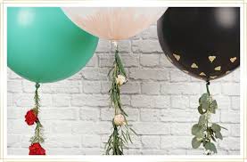 Learn how to make a beautiful centerpiece for fall with balloons and silk flowers! Diy Floral Balloon Garland For Your Holiday Parties Ftd Com
