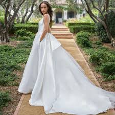 Short lace v neck maternity wedding dress. How To Find The Perfect Maternity Wedding Dress