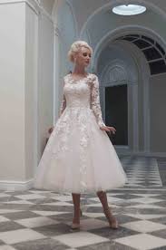Lace short wedding dress tulle overskirt with horsehair accented hem and chapel train, link. Charlotte Fairy Tale Meets 1950s Tea Length Gowns Charlotte Mixes Our Two Favo Tea Length Wedding Dress Vintage Short Lace Wedding Dress Short Wedding Dress