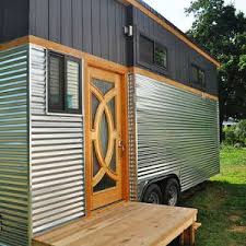 Tiy Getaway A Stunning Luxury Tiny Home From Handcrafted Movement The 26 X 8 5 Home Has A Full Kitch Tiny House Wood Stove Tiny House Luxury Tiny Home Cost