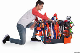 My wife found a picture of a very fancy looking nerf gun rack on pinterest that was made pretty simply out of pegboard. Amazon Com Nerf Elite Blaster Rack Storage For Up To Six Blasters Including Shelving And Drawers Accessories Orange And Black Toys Games