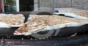 Traditional Lebanese Snack Cooking On The Saj Lebanese Recipes Food Street Food