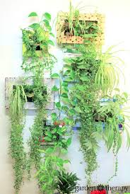 Don't just create a mini indoor garden, but create a fairy garden like this one from dabbles & babbles! Liven Up Your Home With Indoor Vertical Wall Planters Garden Therapy