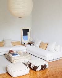 An elegant, traditional style small living room with matching curved sofas and an ornate coffee table with a light wood inlay. Low White Sofa Lounge Via Pinterest Furniture Design Living Room Small Living Rooms Living Room Designs