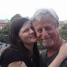 What is a good caption for a picture of a dachshund family in the rain?