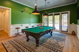 Get the glass table bases and dark coloured flooring to complement the bright windows. Turn Your Basement Into A Games Room Econo Basement