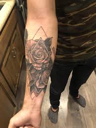 Tattoo roses on the shoulder for men blood appears to drip off this tattoo of a rose on a man's shoulder, running down the leaves onto his arm. Geometric Roses By Dominic Holmes At Big Brain Productions Omaha Ne Rose Tattoos For Men Cool Forearm Tattoos Arm Tattoos For Guys