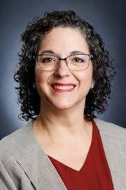 It's been a challenging semester, and our health center staff has been  nothing short of amazing. Leading the charge is Clinical Director Lisa  Geier (center), who also sits