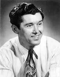 Roy Acuff sits back and listens to Raymond Fairchild playing Shucking The  Corn