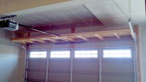 Diy network offers smart solutions for storing large items, like bikes, kayaks and surfboards, in the garage. 4 Ft Shelves Over Garage Door Diy Overhead Garage Storage Overhead Garage Storage Diy Garage Shelves