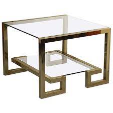 The regent coffee table has a striking, asymmetrical 8mm glass top. Stylish Greek Key Brass And Glass Coffee Table At 1stdibs