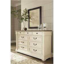 This bedroom set features 1 king size bed with paneling and wood overlay accents on the tall headboard, 1 mirror, and 1 dresser with 9 spac. B647 131 Ashley Furniture Bolanburg Bedroom Dresser