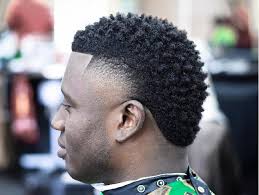 For a casual take, consider an upholstered one in a modern neutral—think black, white or grey. Black Men Curly Afro Novocom Top