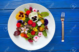 Make sure to make a positive. Edible Flowers Salad In A Plate On Blue Wooden Table With Fork Stock Photo Picture And Royalty Free Image Image 74821975