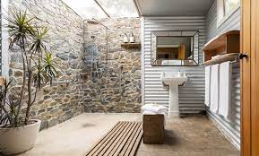 The freestanding tub is lighted by a glamorous chandelier. 15 Of The Best Open Design Showers