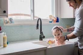 Gather the supplies you'd use for a sponge bath, a cup of rinsing water and baby shampoo, if needed, ahead of time. Top 10 Baby Bathing Tips Kitchen Sink Baby Bath