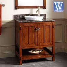 Leaning toward the recent craftsman revival, using oak woodwork and stylish lighting, earthy tones, and perhaps art tile. Oak Bathroom Vanities Mission