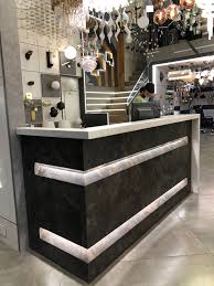 Stone Finish Reception Table Entrance Showroom Corian Top Lighting Office Counter Design Counter Design Office Reception Table Design