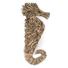 Create an art feature out of a coat rack, with this line of alternating black minimalist wooden hooks: Driftwood Seahorse Wall Decor Wayfair