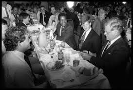 Sen. Edward M. Kennedy waves to supporters as he arrives at his son Patrick  Kennedy's campaign headquarters in Pawtucket: at left is long-time  supporter Frank DiPaolo, 98, Patrick Kennedy in background -