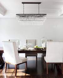 Crystal chandeliers are the first option to install in the dining room area, above the table or two small chandeliers on the ceiling to distribute the lights and make room calm. How To Choose Dining Room Lighting Dining Room Lighting Guide Hgtv