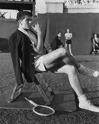 Farley Granger takes a seat between sets while filming the tennis scene for Strangers  on a Train.