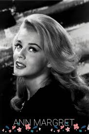 Playing around and having fun with the photographer during a photo session  for her 1st show at the Riviera Hotel in 1967.