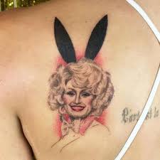 Rumors have always circulated about dolly parton's arm tattoos. Dolly Parton Tattoo Photos Meanings Steal Her Style