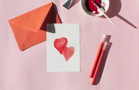 A prototype and a final product. Making A Valetine S Day Card Red Envelope And Card With Love Written On It Stockphoto