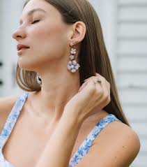 Bridal bliss! We love seeing stunning @thepinkreef bride @lauraburdine in  our brand new Plumeria earrings. We helped Laura pair all her pre wedding  event outfits and wedding day look with coordinating statement