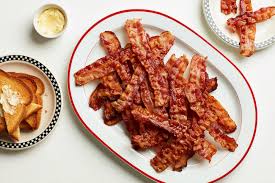 How to bake bacon in the oven. The Diner Trick To Fast Crispy Bacon For A Crowd Epicurious