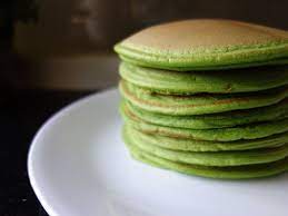 Pandan pancakes are made from pandan leaves with delicious and very naughty freshly grated coconut and palm sugar filling. Soft Fluffy Pandan Pancakes Asian Desserts Food Cooking Recipes