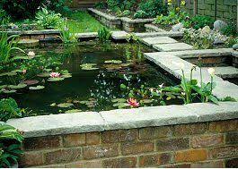 I think the secret to how great this pond looks is the use of pavers and having it against the brick wall. Raised Pond Google Images Backyard Water Feature Water Features In The Garden Raised Pond