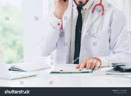 Doctor At Office Table In The Hospital With Patient Health File Medical And Healthcare Concept Ad Sponsored Hospita In 2020 Doctor Office Hospital Office Table
