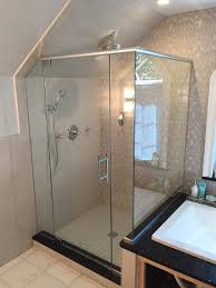 The glass side lite is cut to fit the slope of this ceiling. Frameless Corner Shower Enclosure With Angled Ceiling And Notched Panel For Tub Deck 2 Absolute Shower Doors
