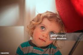 Cute Toddler In His Crib High-Res Stock Photo