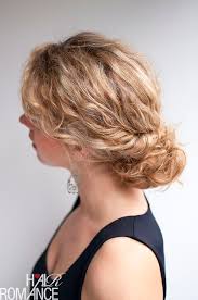 Hold the bun with one hand and use the other hand to stretch another hair tie around the bun until it feels tight and secure. Curly Hairstyle Tutorial The Twist Tuck Bun Hair Romance
