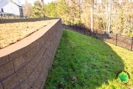 Check out these smart ideas for creating magical landscapes and inviting entries. A Retaining Wall And Fence Improve This Yard S Usability Landscaping Lawn Care And Retaining Walls Between The Edges Augusta Evans Grovetown Ga North Augusta Aiken Sc