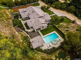 In addition to the privacy features, there are also five bedrooms, six baths, a fountain, movie theater, swimming pool, spa, fire pit, a tennis court, and a. Kylie Jenner S 36 5 Million Holmby Hills Estate Is Spectacular New Photos