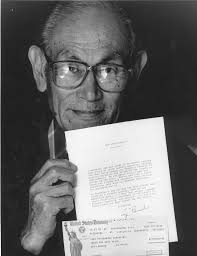 Photo: Fred Korematsu holding a letter from the U.S Government apologizing  for its unjust internment of Japanese Americans durin