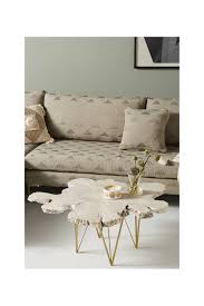 Hand carved furniture from headboards to coffee tables anthropologie's collection of carved wood furniture offers a unique way to bring a touch of the outdoors inside. Yucatan Live Edge Coffee Table Anthropologie Havenly