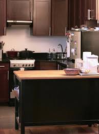 Gather around the kitchen island! Why This Kitchen Island Is My Favorite Thing In My Apartment Kitchn