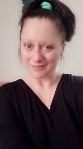 What is the explanation for the mysterious figure in the selfie?