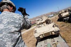 Bradley driver, Spc. Aaron Spielman, 1-185 Armor, works