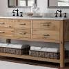 Our showroom features vanities made from solid wood materials and natural marble. 1